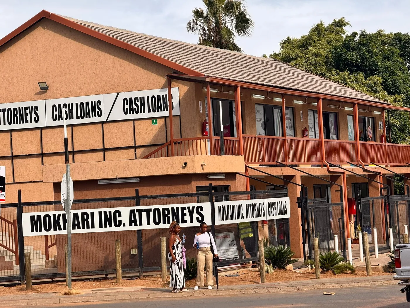 The Mokhari Attorneys Inc building in Temba, a two-storey face-brick building with a long balcony